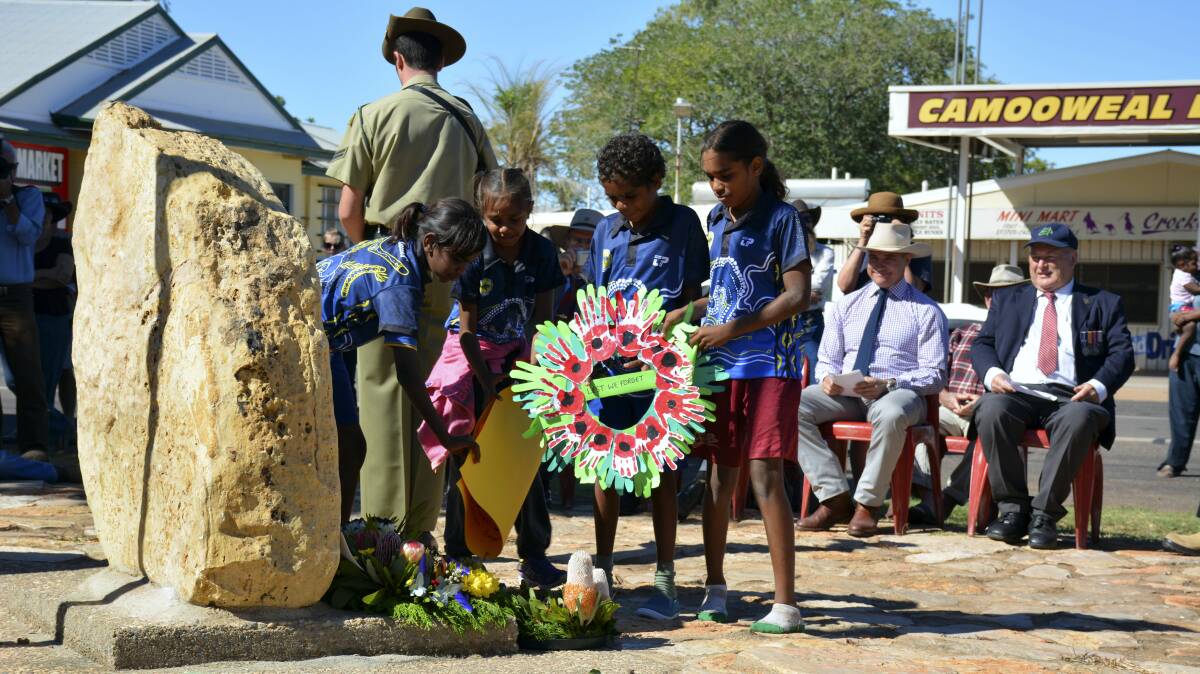 LAYING A WREATH: Camooweal State School students give their tribute. 