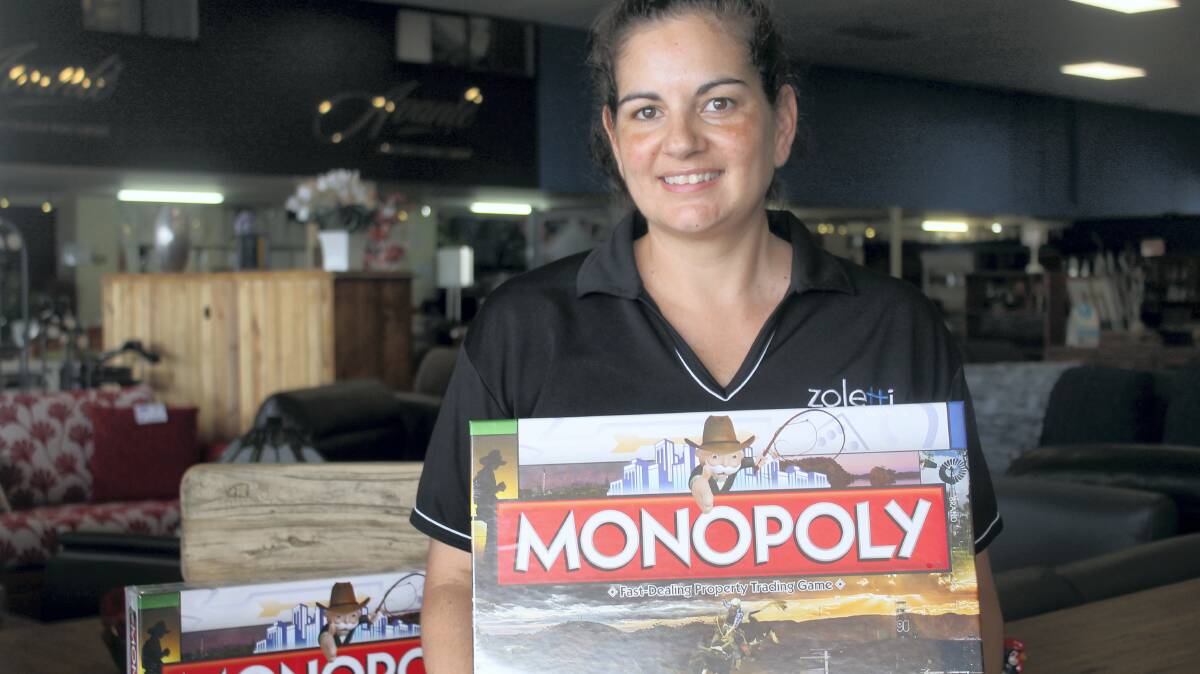 ■PICTURED: Rotary Club of Mount Isa South West member Louise Brogden promotes Mount Isa Monopoly.