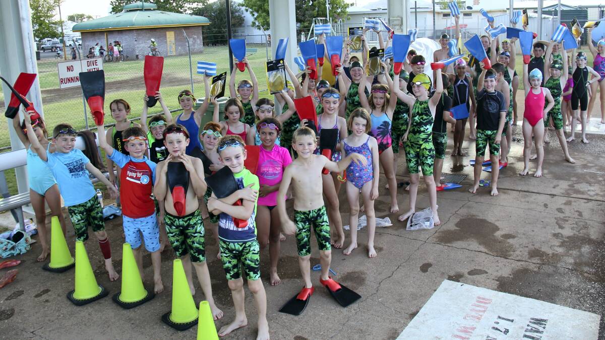 DECKED OUT: Cloncurry Crocs show off their new gear at their swimming meet last month.