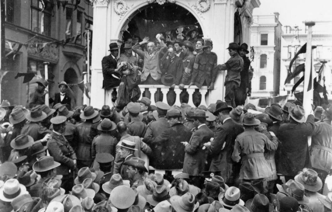 CALL TO ARMS: Prime Minister Billy Hughes campaigns for conscription before a crowd in Sydney's Martin Place in 1916.  Photo: AWM A03376 