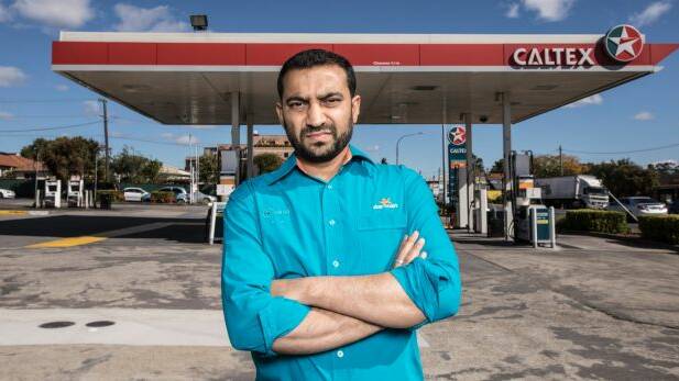 Ash Vatsa stands by the Caltex petrol station in Merrylands where he is the franchisee. Photo: Jessica Hromas