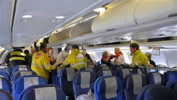 Rescue and medical workers from the Western Australian town of Exmouth met the flight after the emergency landing, 50 minutes after the first nosedive. Photo: Supplied 