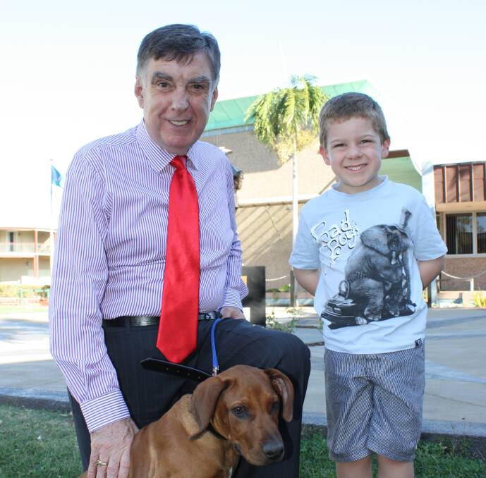 Winners are grinners: Mayor Tony McGrady and competition winner Wil Vidler with his new best friend Sam.