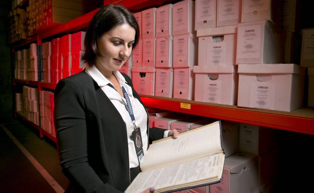 COLD CASE: Detective Senior Constable Deborah Wilson in amongst the archives. Picture: supplied. 