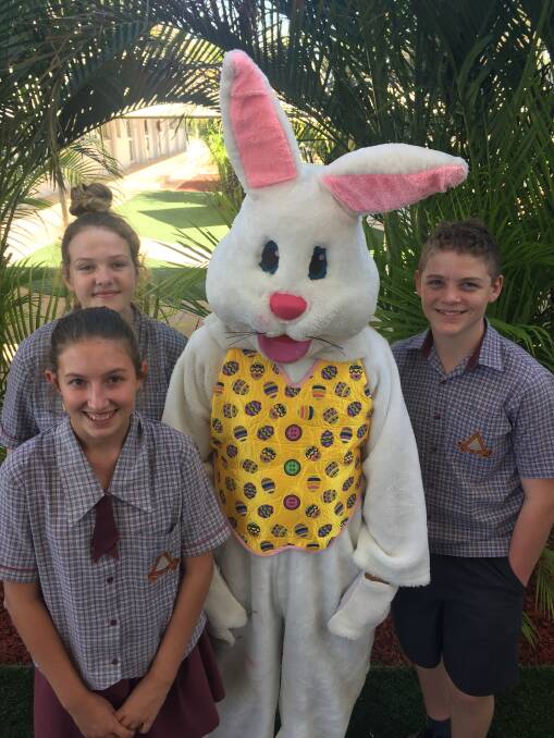 HAPPY BUNNIES: Good Shepherd students Kasey Inskip, Carly Lobegeiger and Charlie Stretton pose with the Easter Bunny. 