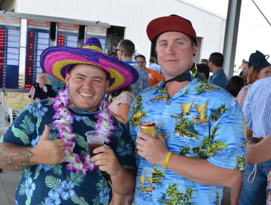 HAWAIIAN FUN: Josh Stanford and Michael Graves at last year's luau races. 