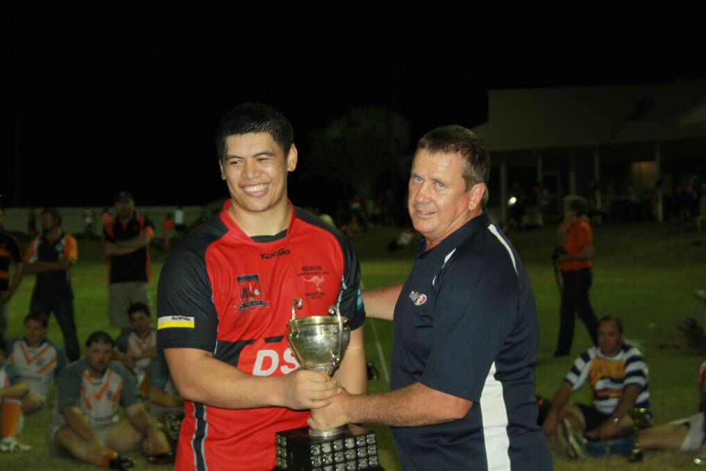 MAN OF THE MATCH: Mount Isa Rugby Union president Rob Campbell hands the Kalkadoon Cup to Euros' Zemic Patuwai. Picture: KEAGAN RYAN/5894