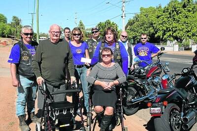 HAVE WHEELS: John Letts with his new wheelie walker and Naomi Lindenberg from Isa Mobility Solutions, front, with members of the HOG, assistant director Tony Moloney, Jason Heyze, Cheryl Moloney, Paul Hey, director Xenia Schraag, Allan Furness and Greg Andersen. - Picture: LIZ MACINTYRE/2694