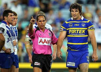 ‘‘He’s just a grub. I’ve been niggled by better’’ ... Parramatta captain Nathan Hindmarsh is sent off as Mick Ennis looks on.