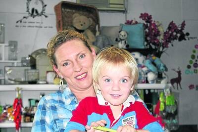 BUSY MUM: Teresa Scobie in her shop with her baby, Harrison, 2. "My kids come first," she says. - Picture: LIZ MACINTYRE/2645
