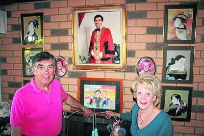 PAST AND PRESENT: Tony and Sandra McGrady in front of a photograph of Tony McGrady in his mayoral robes during his previous reign 25 years ago. - Picture: LIZ MACINTYRE/2628