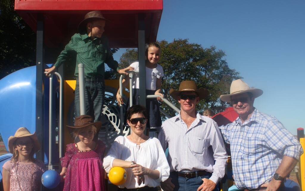 NEW PLAYGROUND: Meredith Tyler, Erica Tyler, Aaron Tyler, Laura Tyler,Gorgia Green, Nathan Keyes and Cloncurry mayor Andrew Daniels enjoy the newly opened Cannington Playground at the racecourse.