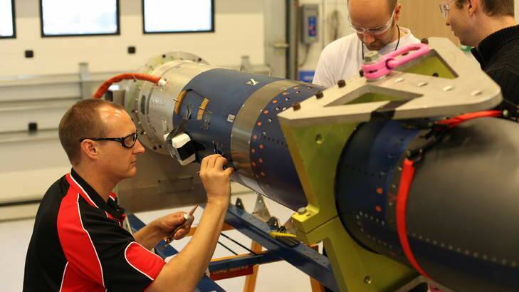 The University of Queensland Scramspace team reparing the payload for launch. Photo: University of Queensland