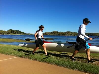 TIME TO RACE: Tina McCarthy and David Knight drag their craft into Lake Moondarra at the weekend.- zz