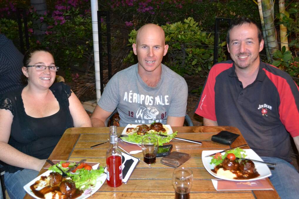 STEAK: Monica Vella, Ash Milroy and Dean Booth enjoy their dinner from the cafe at The Buffs Club.