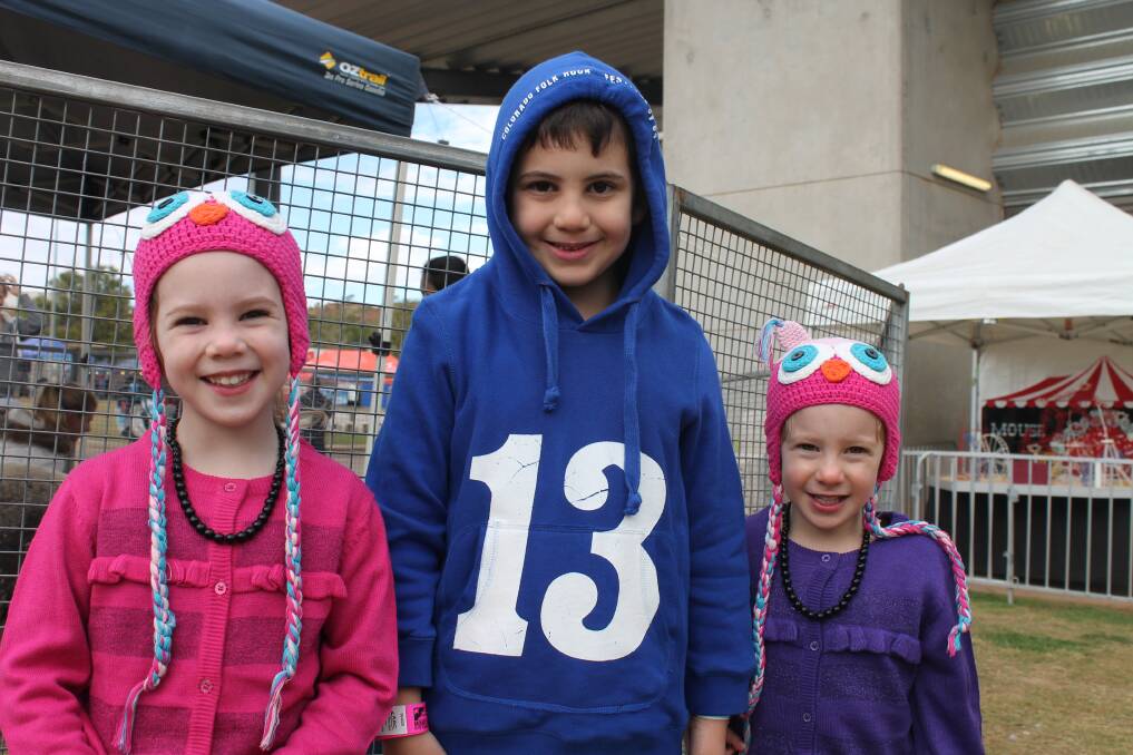 RUGGED UP: From left, Ava Murphy, 4, Caeden Murphy, 6, and Niah Murphy, 4, are excited to be at the show.
