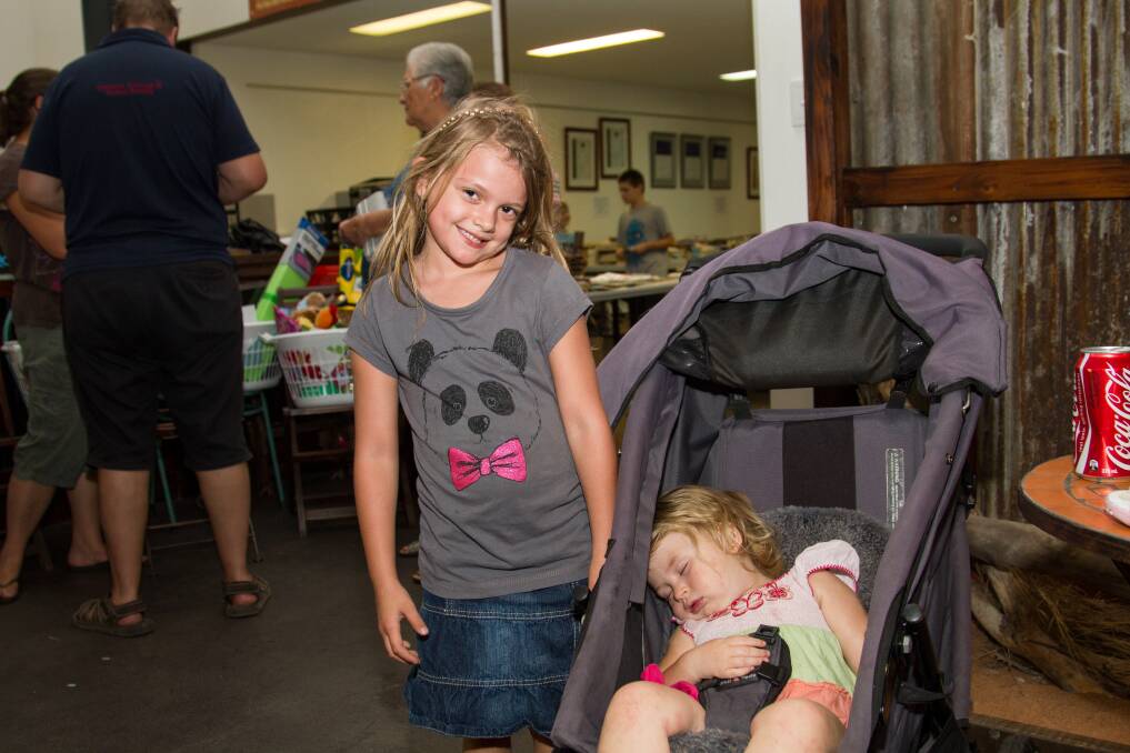 ALL WORN OUT: Anna Munster with her little friend Makenzee Dahlenburg after a day of play.