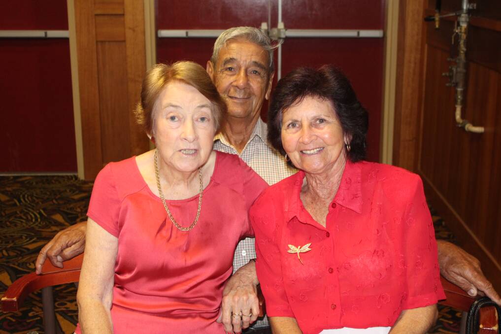 RED: From left, Joy Finlay, Ben and Edna Trindle wore red to get in the spirit.