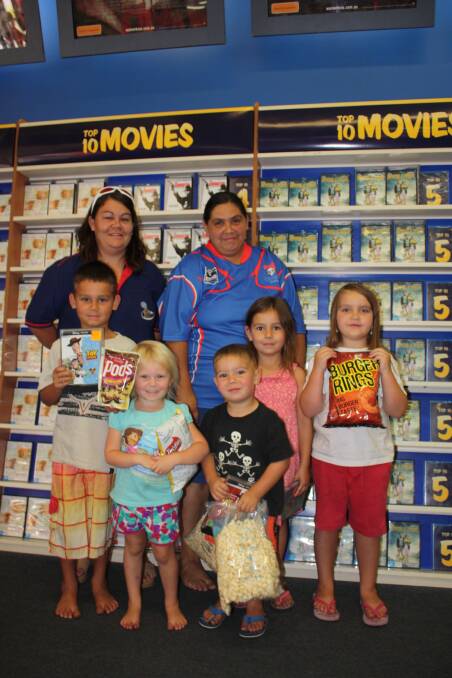 MOVIE TIME: Sisters Jenny Coggan and Tina Barry with their children (from left) Texas Cox, Abigail Cox, Dominic Barry, Piper Cox and Kathleen Barry choose their favourite Christmas movies. - Picture: JASMINE BARBER/7102