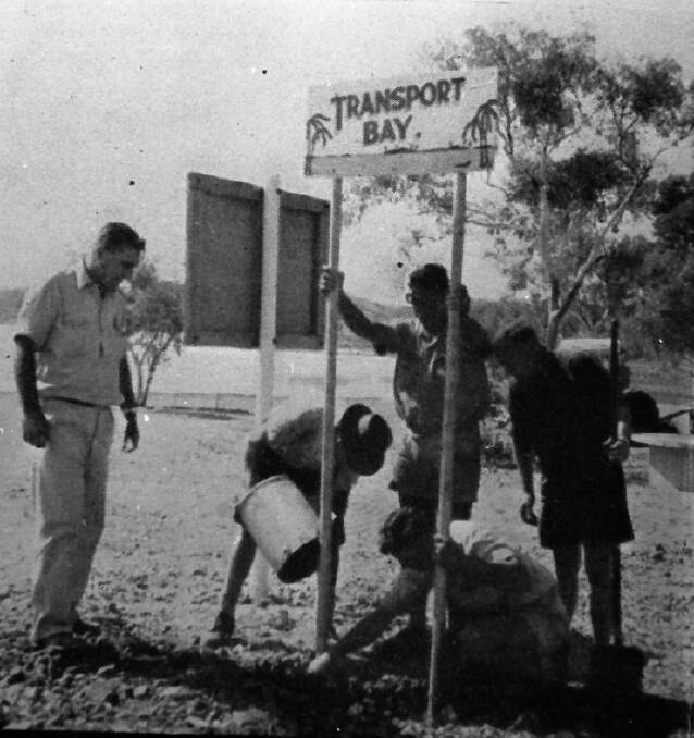 NAMING: The name and sign go up at Leichhardt Dam in 1960
