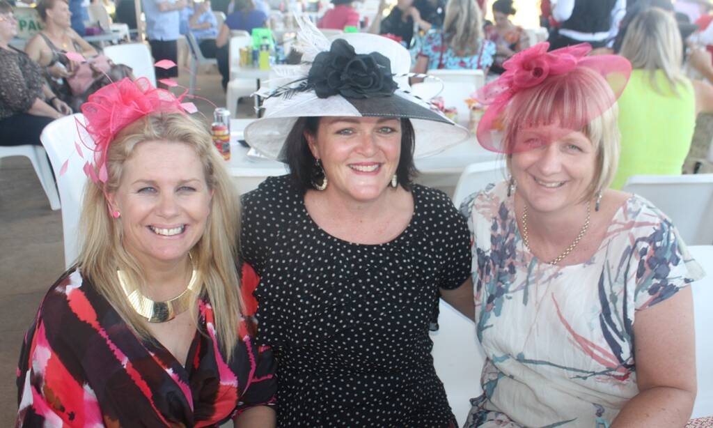 SITTING PRETTY: Jane Storman, Tamara Griffiths and Sheri Atkinson pose for a picture at the races.