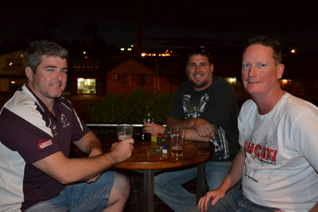 GUYS NIGHT: Chris Klowss, Nathan Blennerhassett and Todd Chippindall winding down the four-day week with some drinks.