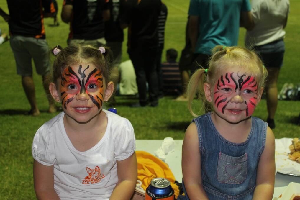 COUSINS: Ashleigh and Jaycie Ferris show off their face paint.