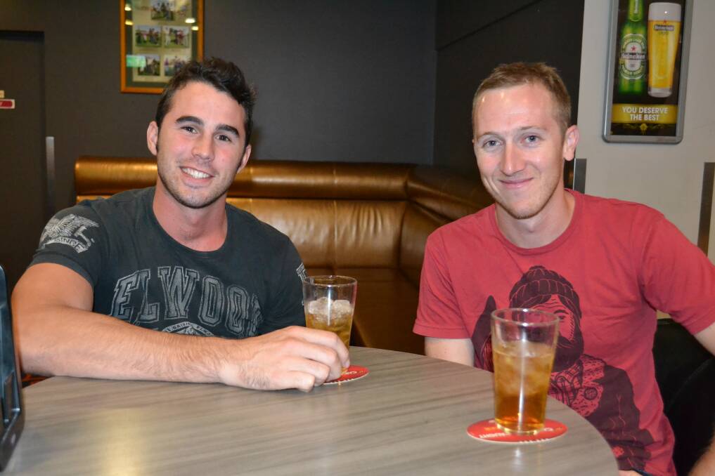 OUT OF TOWNERS: Ben Osborne and Dave McMurtrie from Darwin enjoy some drinks on their last night in town.