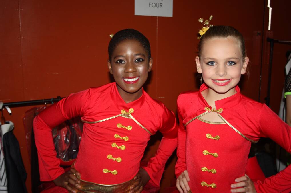 BIG SMILES: Looking radiant in red are Kampamba Nkamba, left and Daina Beck, 11.