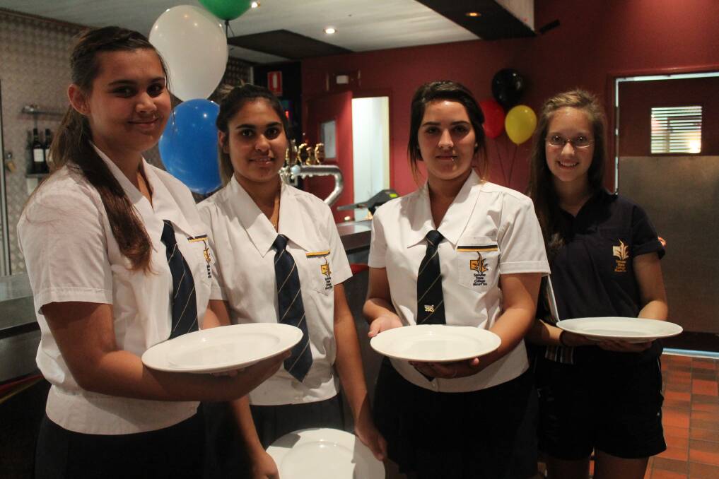 SERVICE: Spinifex State College students Jacqueline Rogers-Page, 16, Mykaela Hart, 16, Zoe Page, 17, and Monty Kippist, 15, waited on the elders at yesterday's luncheon.