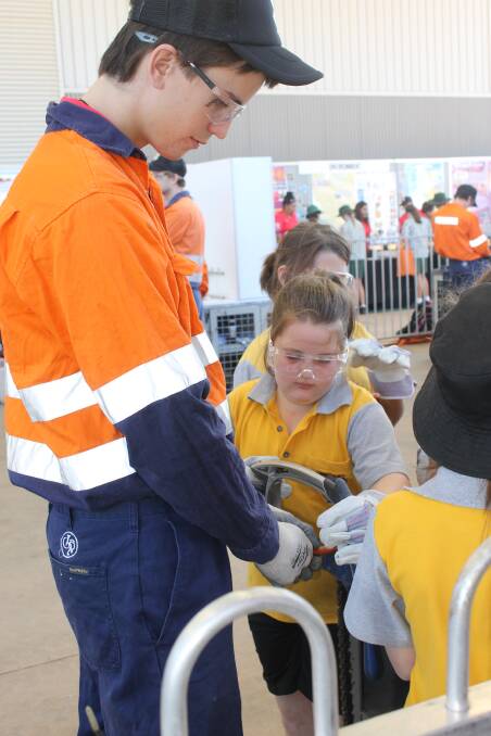 LEARN: First year Xstrata electrical apprentice Craig Cronin with Cloncurry State School student Grace Couchman, 11.