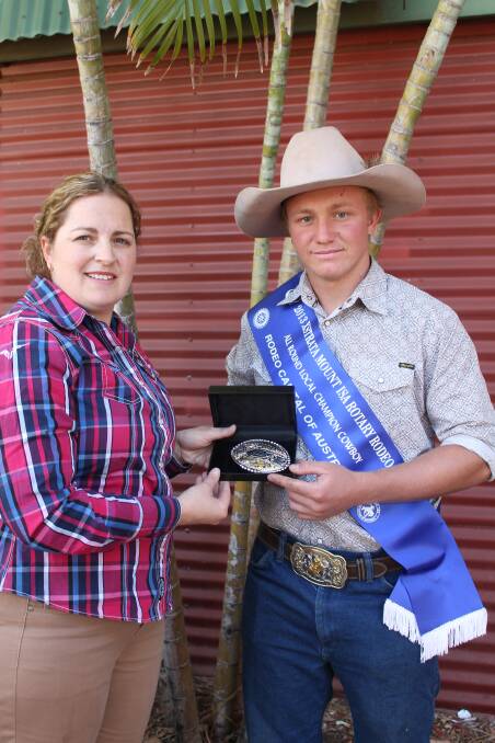 ALL ROUND CHAMP: Rodeo manager Donna Kuskopf congratulates All Round Local Rodeo Champ 2013, Cody Tully. - Picture: JASMINE BARBER/7930