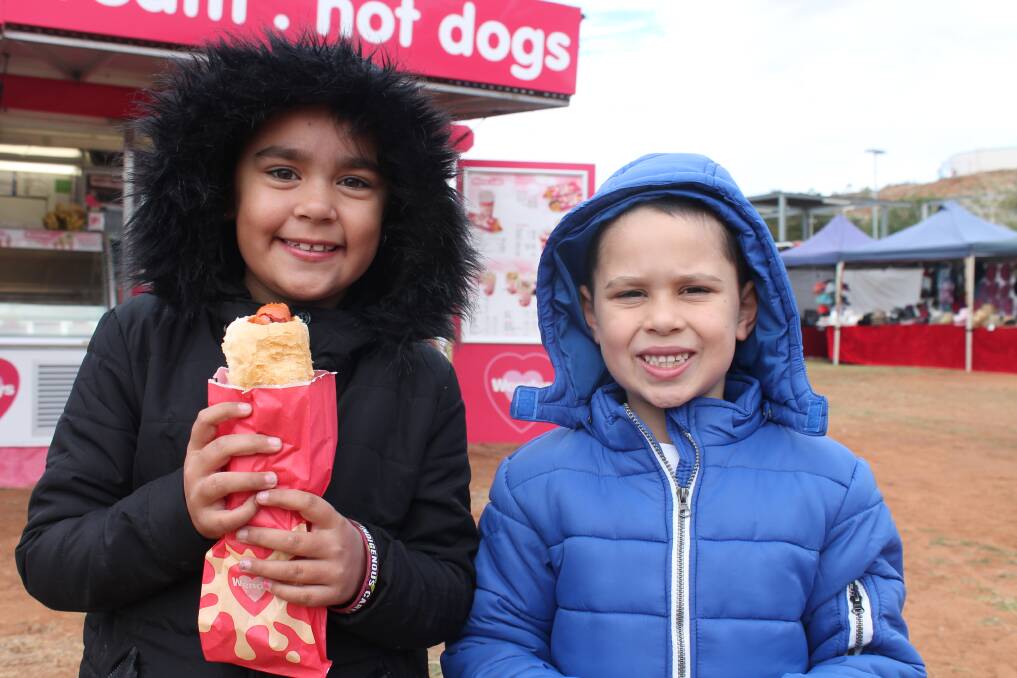 HOT DIGGETY DOG: Jade Brown, 8, and Kobi Brown, 6, enjoy some carnival food.