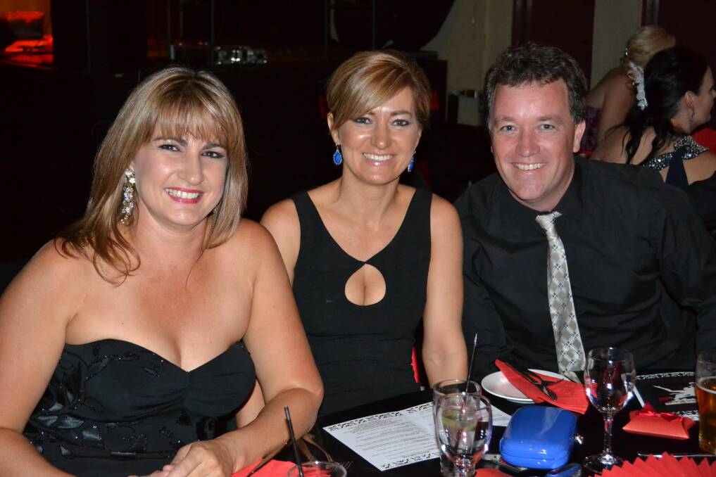 FRIENDS: Shannon Ward, Maria Johnstone and Jason Keely waiting for their dinner.