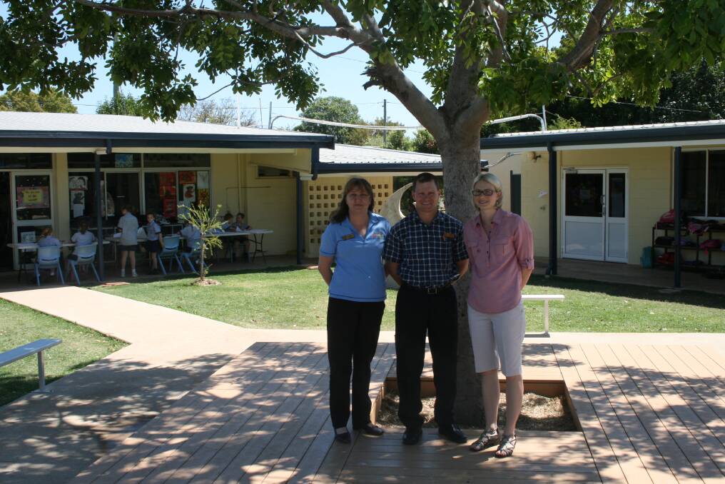 SHADY SPOT: St Joseph's Catholic School staff, administration officer Mary Robertson, principal Bob Grant and assistant principal Therese Curley enjoy the shade of the new courtyard.