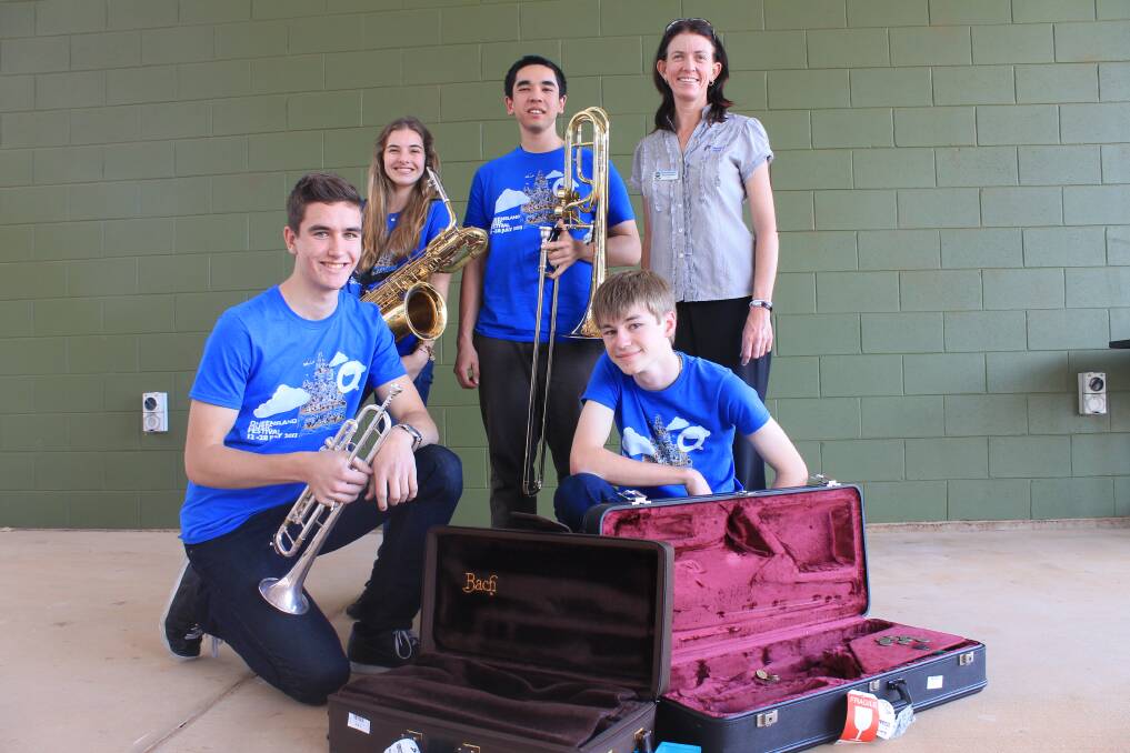 FINAL PREPARATION: Queensland Youth Orchestra Big Band members Luke Hester, Ashleigh Howell, Sean Mackenzie and Sam Hewerdine used Mount Isa School of the Air to practice yesterday with Swingin' Utes organiser Yvonne Moore. - Picture: EMMA KENNEDY/7739