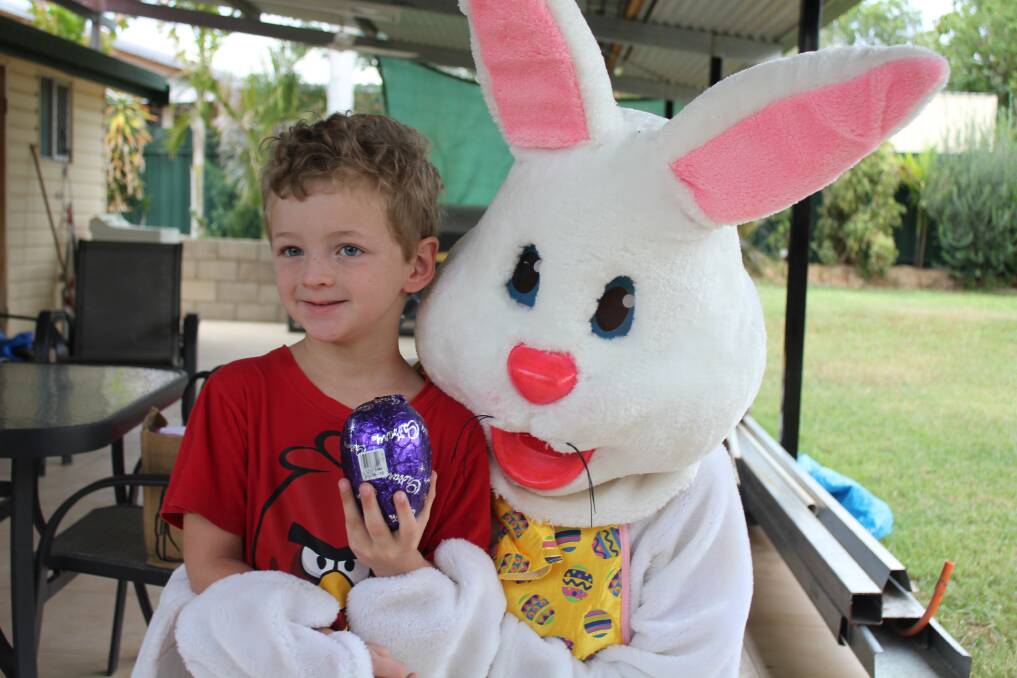 CADBURY SMILES: Ethan Geary, 5, gets a delivery from the Easter Bunny before he heads off to church.