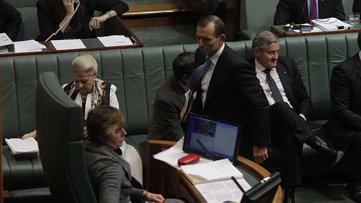 Opposition Leader Tony Abbott leaves question time after being ejected from the chamber by acting Speaker Anna Burke during question time.