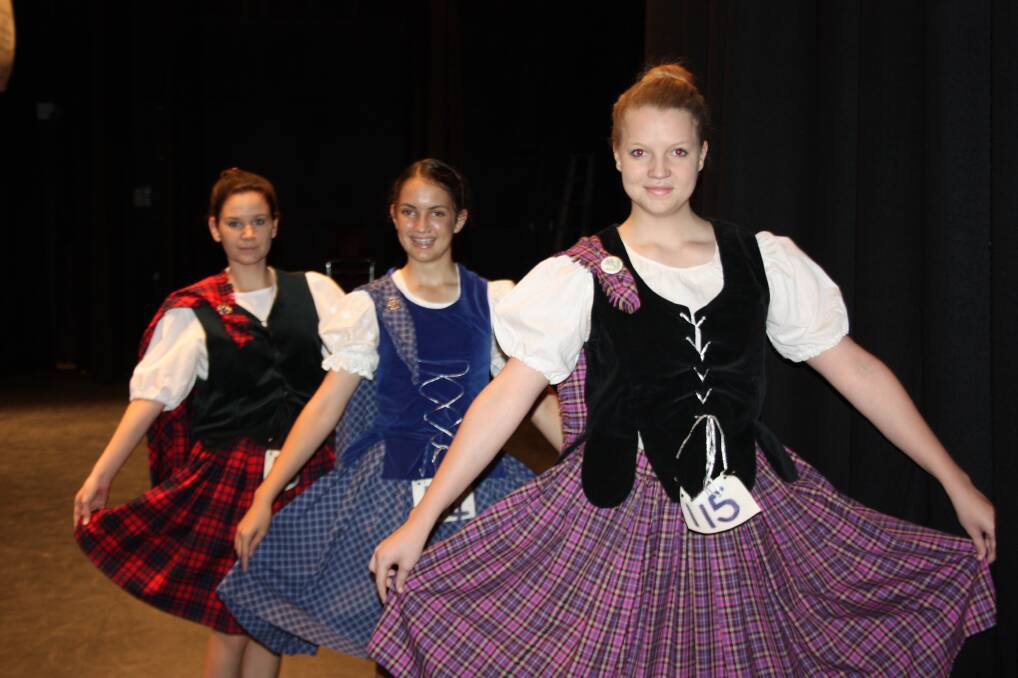 TARTAN TRIO: From left, Sasha Katanko, Julia Sturmfels and Alex Noble ready to dance on stage.