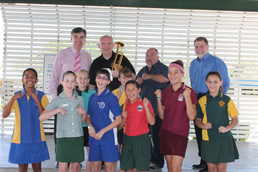 FESTIVAL EXCITEMENT: From back left, Mayor Tony McGrady, James Morrison, John Morrison, Xstrata's Steve de Kruijff and children from Cloncurry and Mount Isa schools are ready to rock the city. - Picture: JASMINE BARBER/7550