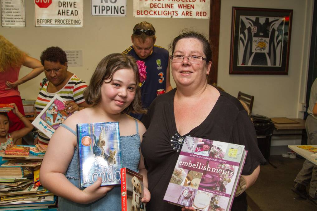 DOUBLE TROUBLE: Olivia and Maria Hunter-Robinson found fantasy and craft books to take home on Sunday.