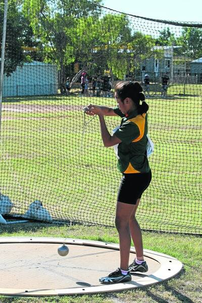 LEGEND OF AN ATHLETE: Jakarra Carney prepares herself before her second hammer throw at the weekend. Carney was one of 11 athletes to receive Legend certificates for outstanding performances during Mount Isa Athletics Club's third meeting of the season. - Picture: LYNDON KEANE/2876