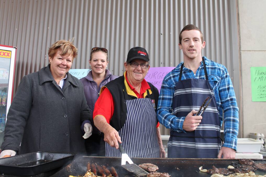 BARBECUE MASTERS: From left, Judy Lloyd, Cassie Lloyd, Lyne Graham and Matti Rumbalu, keep the crowd fed at the show.