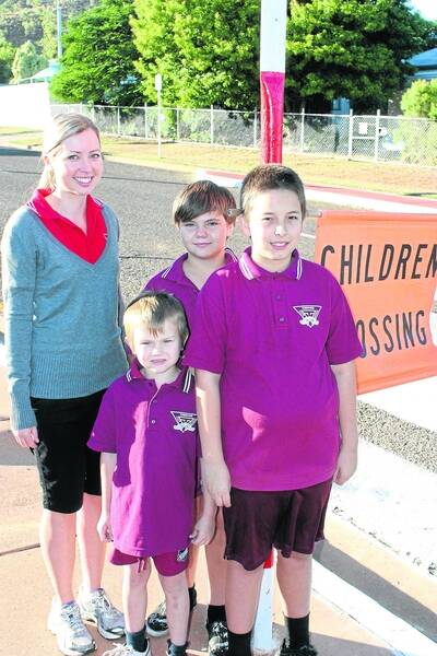 SAFE WALK: Year 7 teacher Bianca Smith with students Jesse Power, Liam Handley, Richard Bower at the Townview State School crossing. - Picture:BRAD THOMPSON/5502