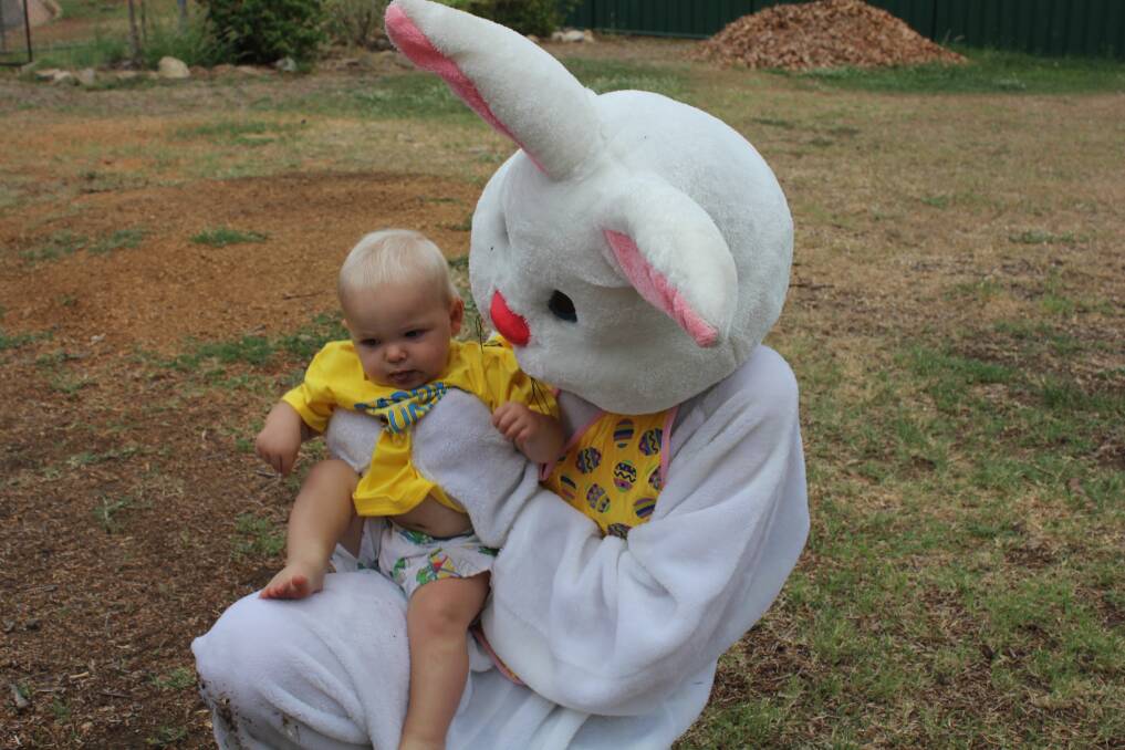 FIRST TIME: James Keith Evans, 12 months, wasn't quite sure how to react to his visit from the Easter Bunny.
