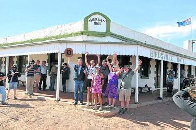 WELCOME: A crowd greets Ms Trumper outside the Birdsville Hotel. -Picture: KELLY THEOBALD/zz