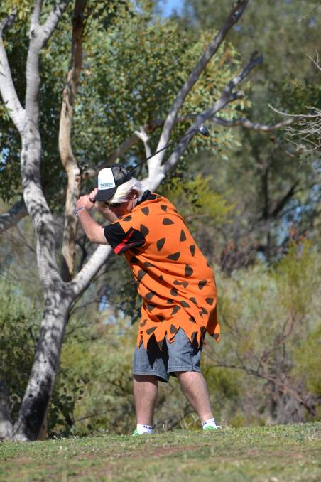 FRED FLINSTONE: "Rossco" playing golf in his funny costume.