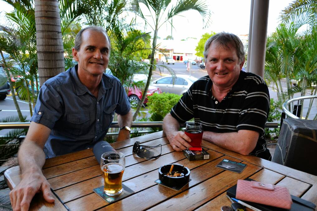 RELAXED: John Cumins and Bart Cumins wind down the week with some quiet drinks.
