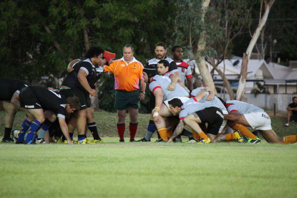 TOUCH, HOLD: New Zealand and the rest of the world prepare for a scrum during the Waitangi Day match.