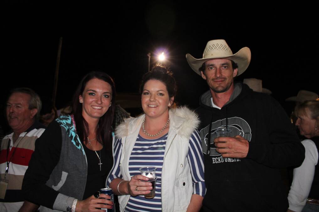 CATCH UP: Mallory Doyle, Nicole McDonald and Chris McFee catch up to watch some rodeo action.